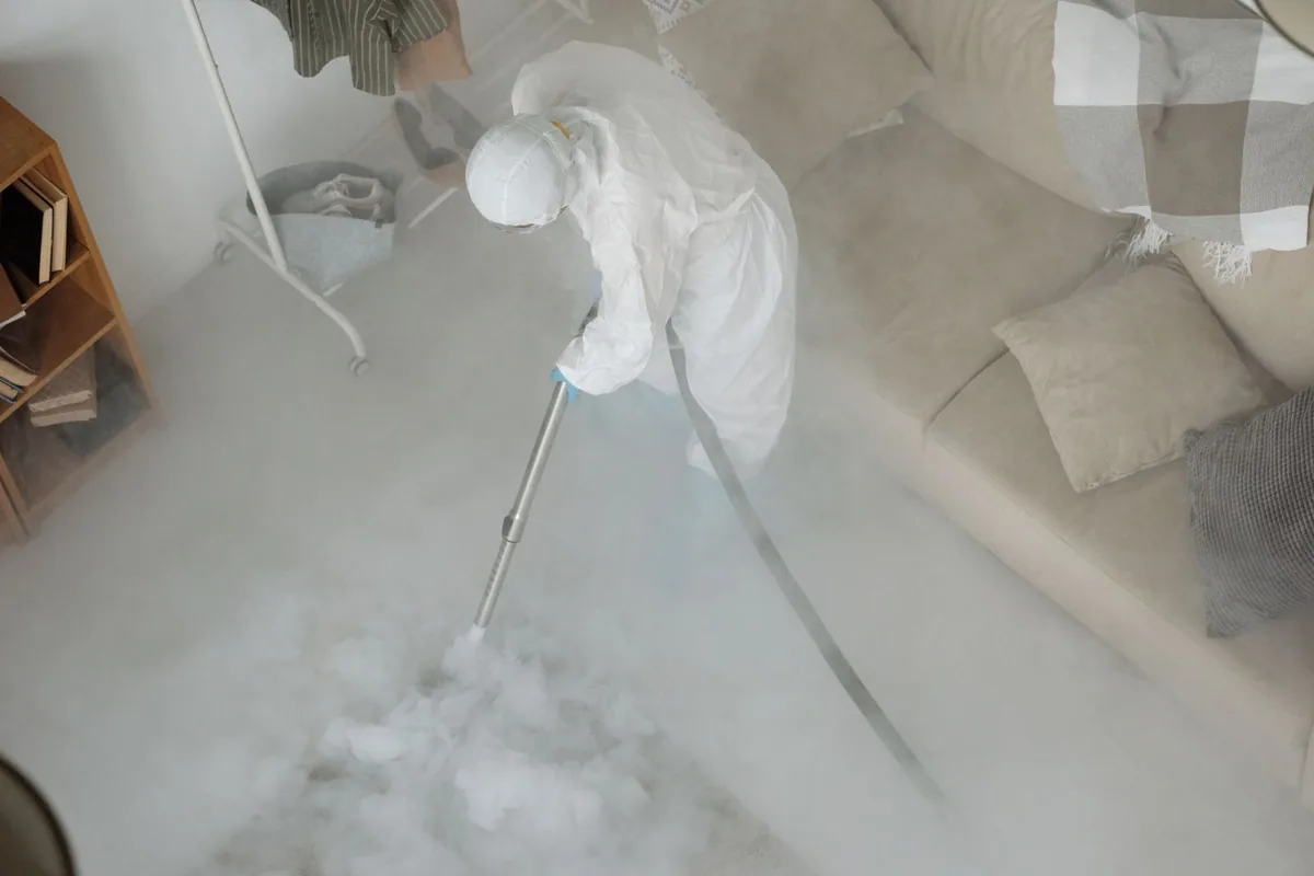 Biohazard cleanup technician in protective equipment, Alexandria, VA